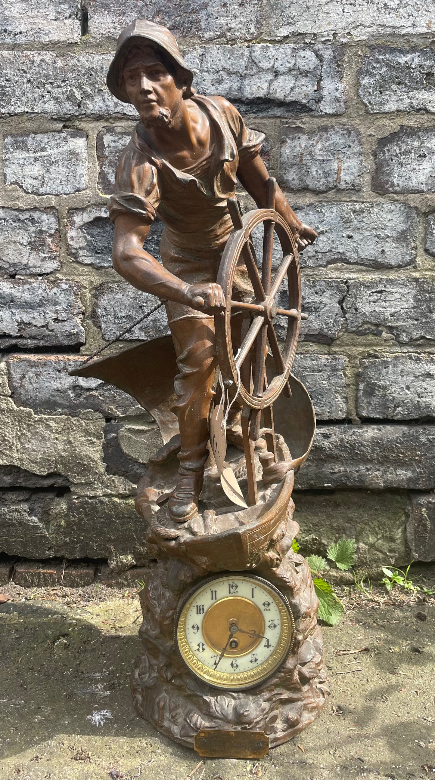French Art Nouveau bronze statuette clock with a sailor at the helm. Circa 1911