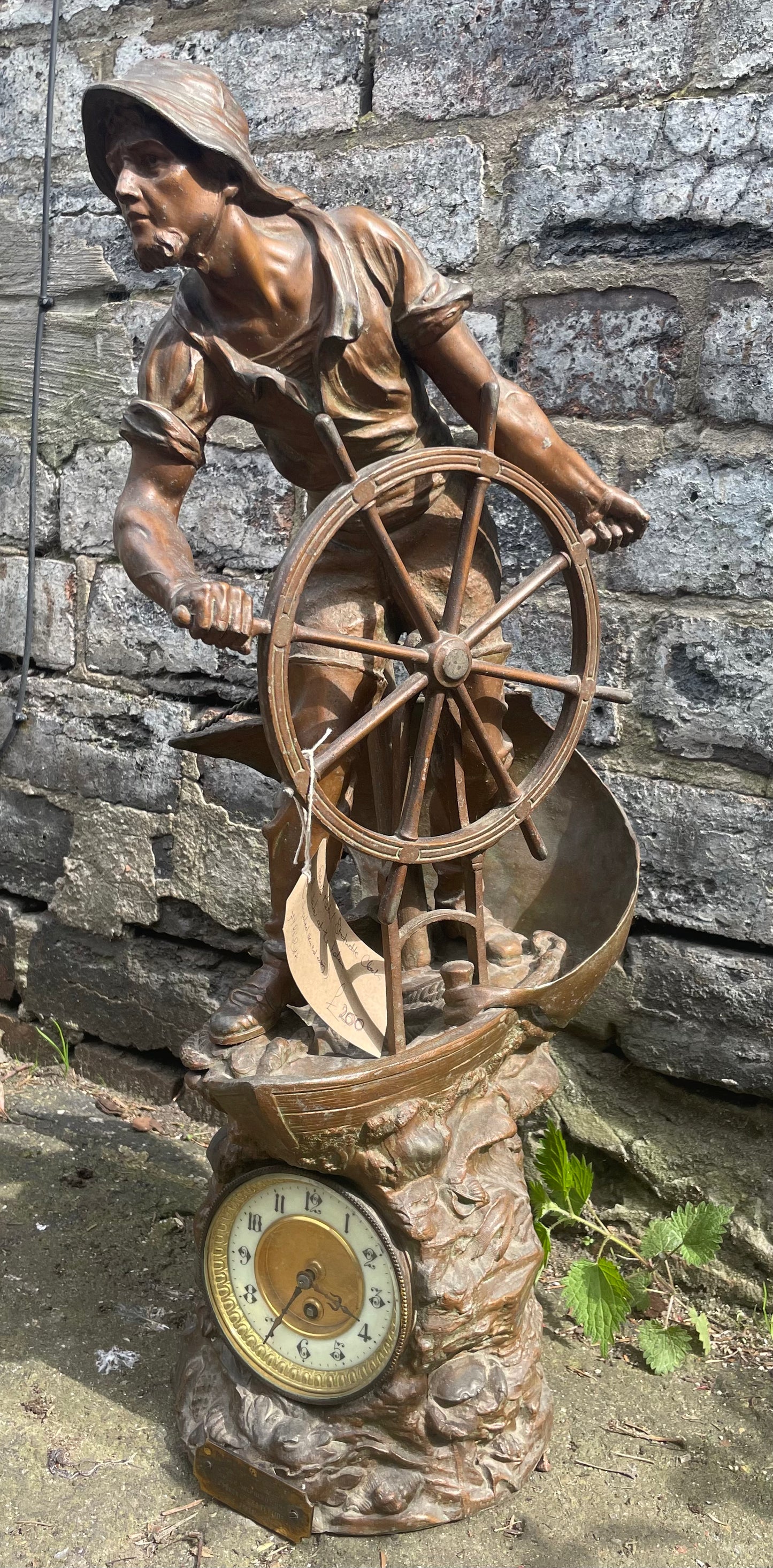 French Art Nouveau bronze statuette clock with a sailor at the helm. Circa 1911