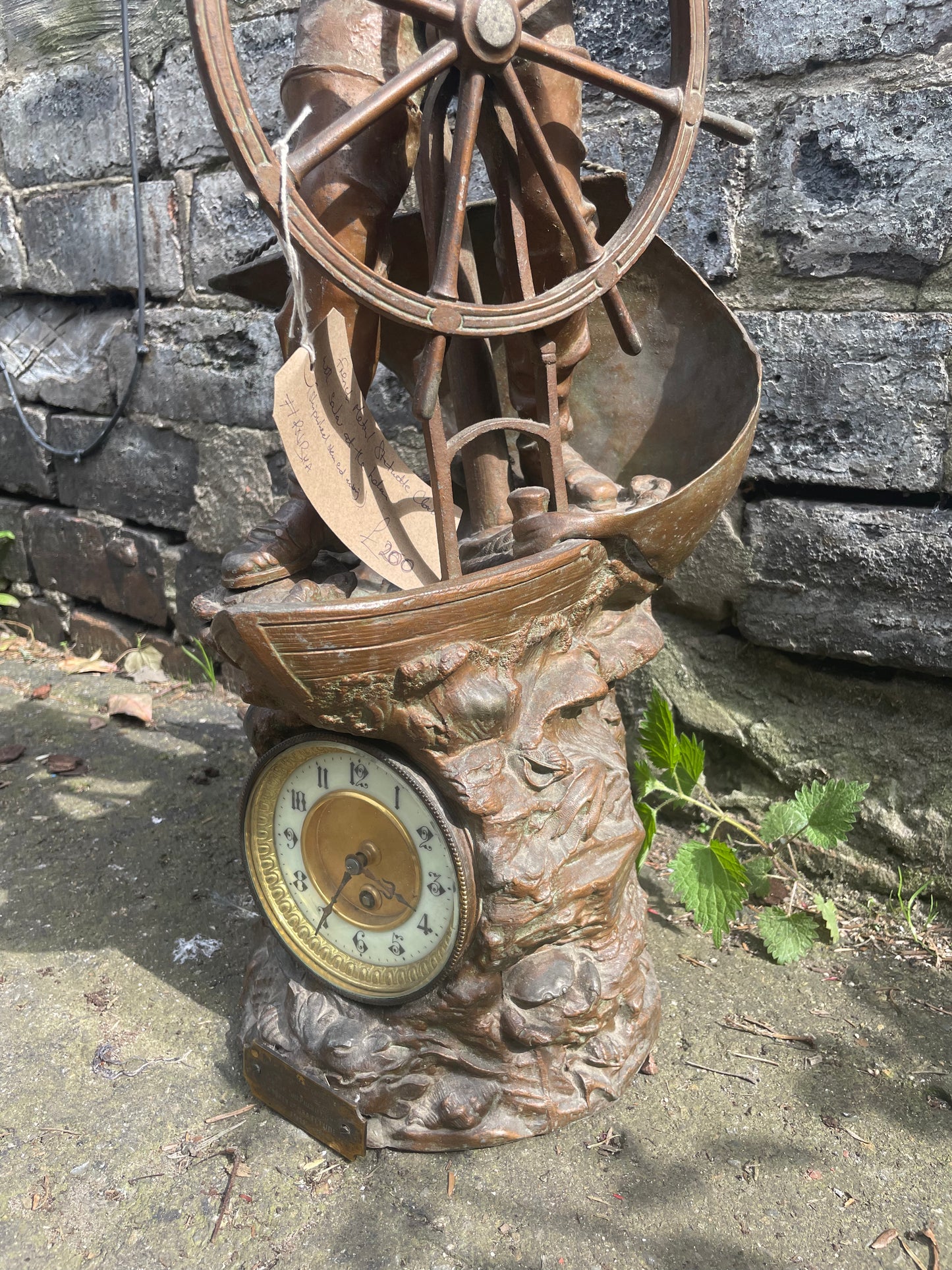 French Art Nouveau bronze statuette clock with a sailor at the helm. Circa 1911